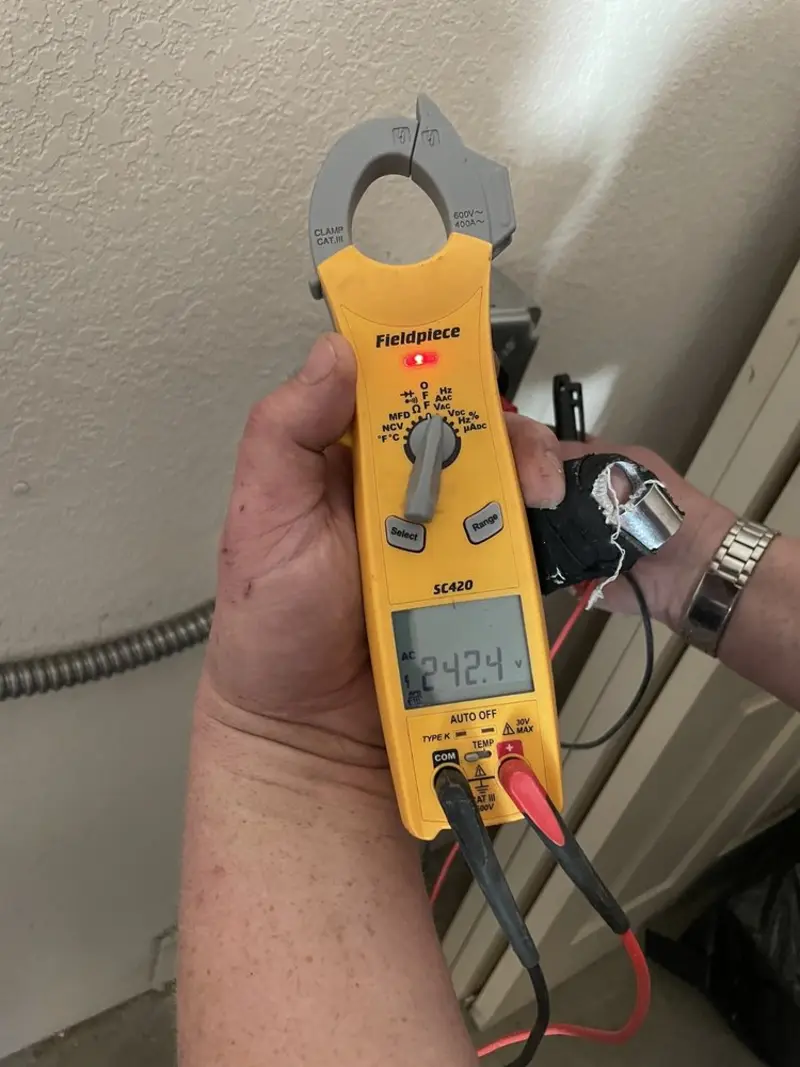 Voltage testing with clamp meter during Circuit Breaker Repair in Rockville Centre